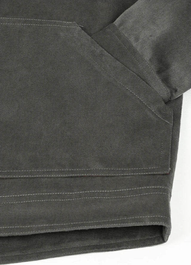 Detailed view of the hand pocket of the gray men's cozy flannel lined shacket