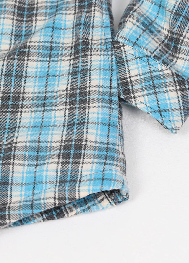 Zoomed-in of women's button down blue white plaid flannel jacket hand pocket