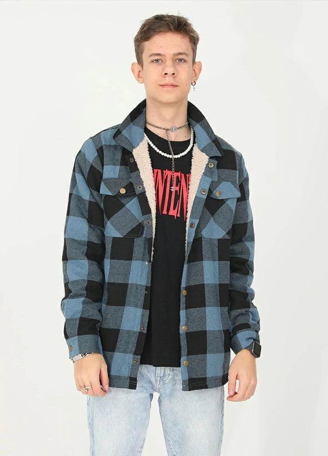Front view of a boy wearing a blue black kids flannel shirt jacket