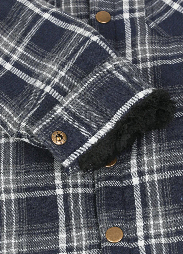 Close-up of cuff with button on kids Navy White plaid flannel jacket