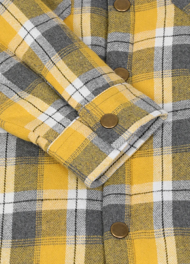 Close-up of cuff with button on kids Yellow plaid flannel jacket