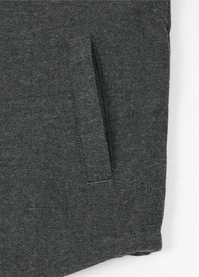 Detail of kids black plaid flannel jacket with warm hand pocket