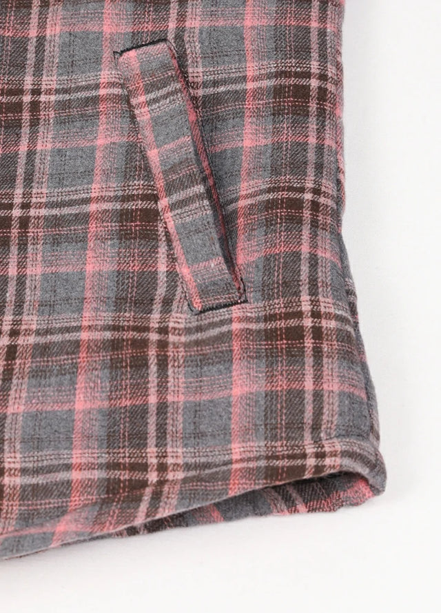 Close-up of women's gray pink sherpa-lined shirt jacket hand pocket