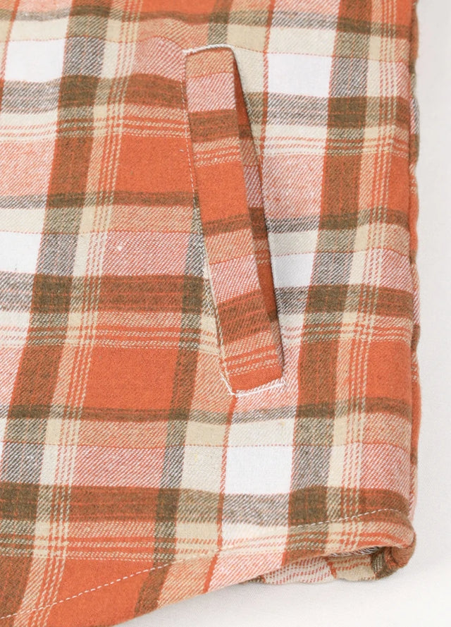 Close-up of women's rust red sherpa-lined shirt jacket hand pocket