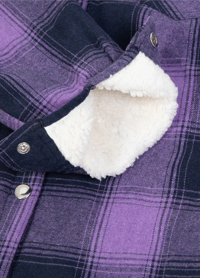 Zoomed-in view of the cuffs on a womens winter snap purple shirt jacket
