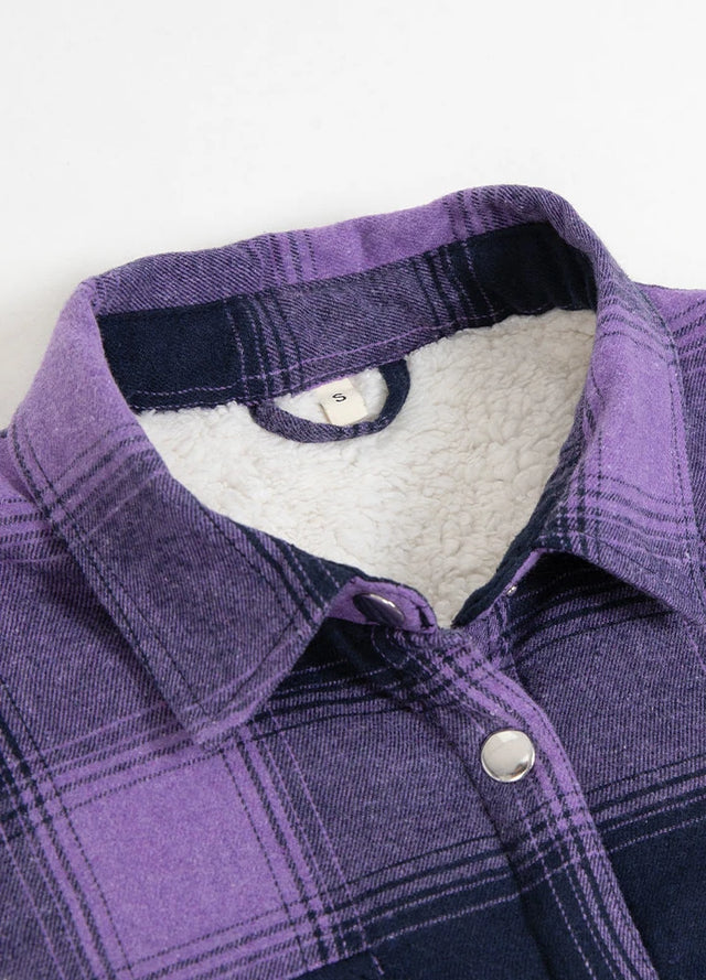 Close-up of womens sherpa lined warm purple flannel shacket collar