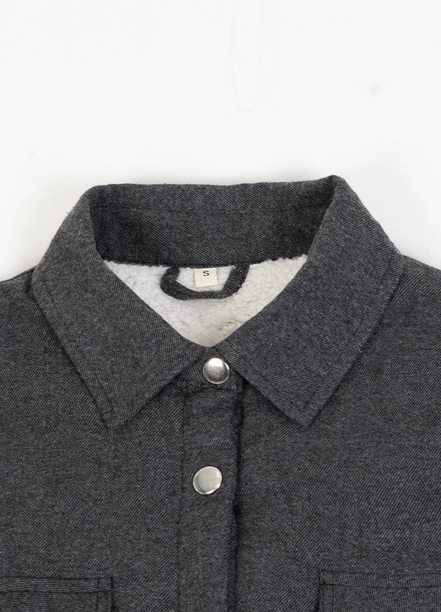 Close-up of womens sherpa lined warm gray flannel shacket collar