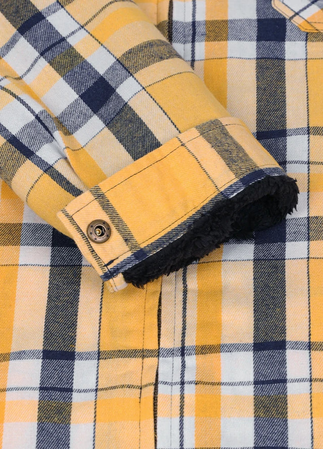 Close-up of the cuff of a men's yellow and navy sherpa lined flannel jacket