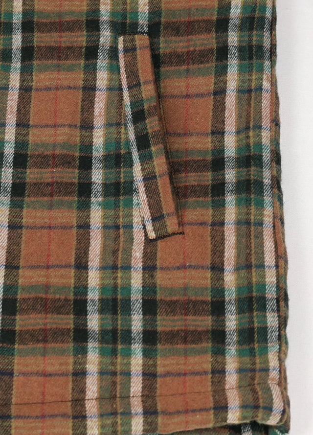 Close-up of the handpocket of the brown green sherpa lined plaid shacket for men