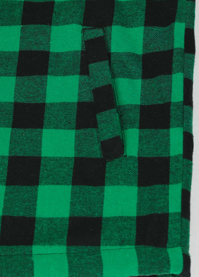 Close-up of the handpocket of the green black men's warm sherpa lined plaid flannel shacket