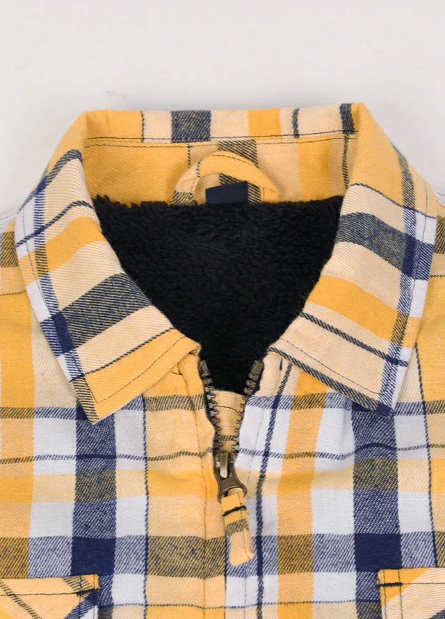 Close-up of the lapel of the yellow and navy men's fleece lined flannel shacket
