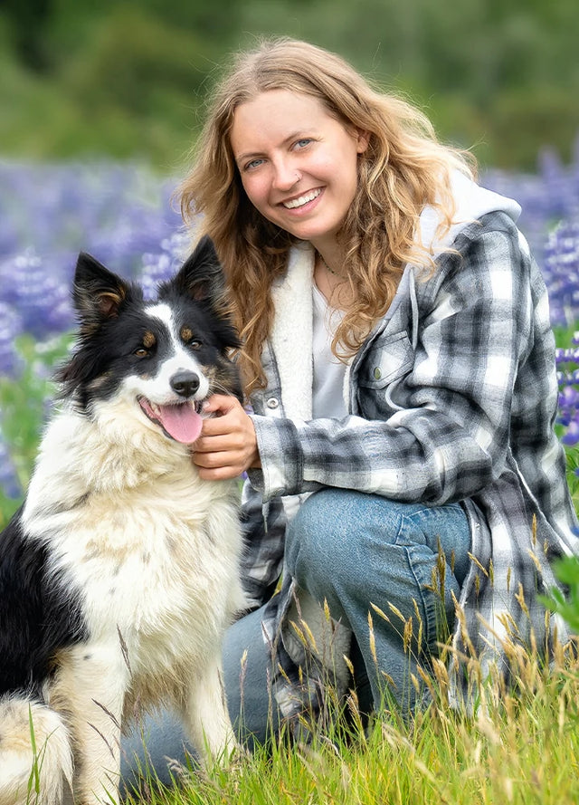 Women in a black white sherpa-lined flannel jacket with fleece hood