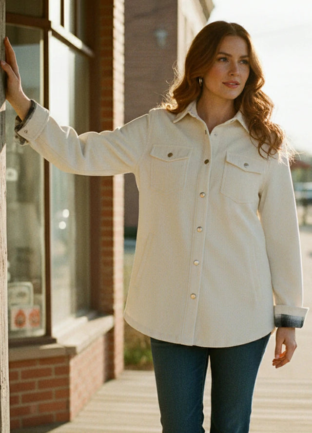 Lifestyle view of a woman wearing cream women's oversized fit flannel-lined long-sleeve corduroy shirt jacket-XR191BJL-S,XR191BJL-M,XR191BJL-L,XR191BJL-XL