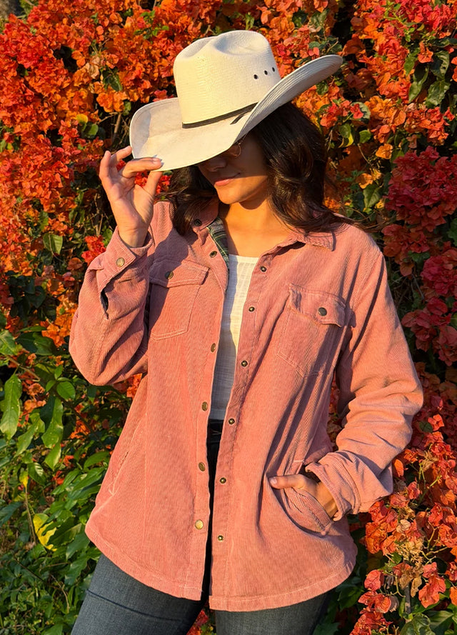 Lifestyle view of a woman wearing rose quartz women's oversized fit flannel-lined long-sleeve corduroy shirt jacket-XR191RQ-S,XR191RQ-M,XR191RQ-L,XR191RQ-XL