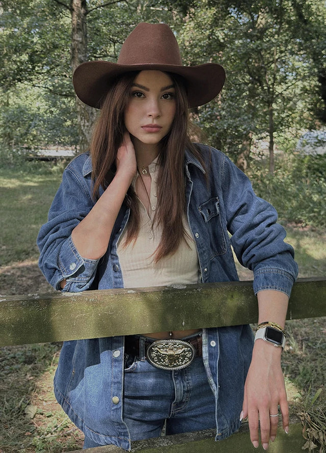 Side view of women in a blue snap flanne-lined denim jacket