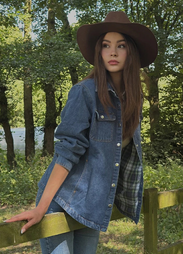 Side view of a woman wearing a blue denim jacket with flannel lining