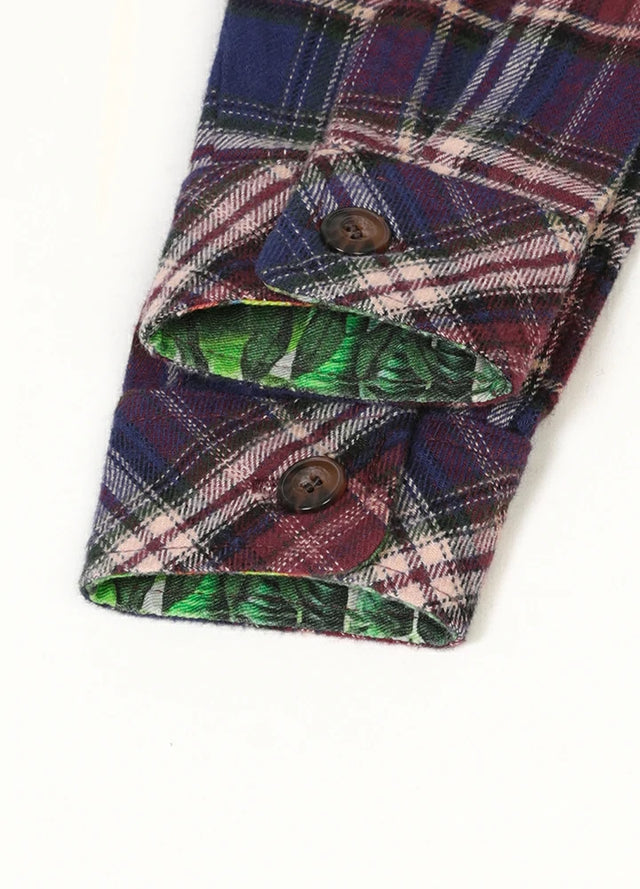 Cuff detail of Men's burgundy plaid flannel shirt