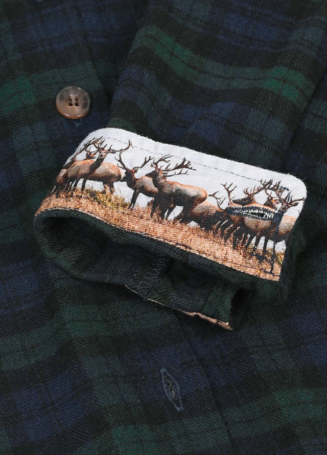 Detailed view of the printed cuffs on a mens dark green flannel shirt