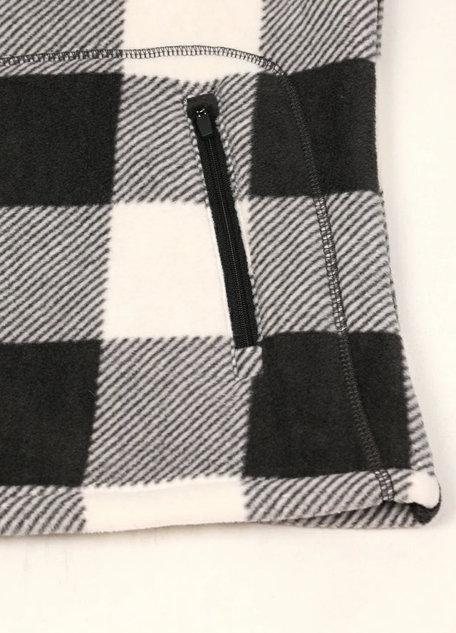 Close-up of women's black white sherpa-lined fleece jacket hand pocket