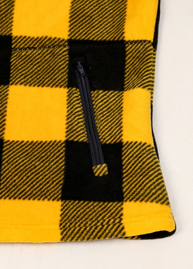 Close-up of women's yellow black sherpa-lined fleece jacket hand pocket