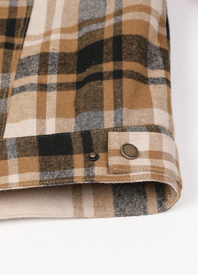 Detailed view of the hem of a beige latte men's outdoor fleece lined shirt jacket