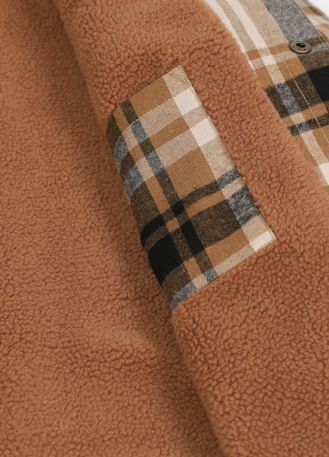 Close-up of the inner pocket of a beige latte men's outdoor fleece lined shirt jacket