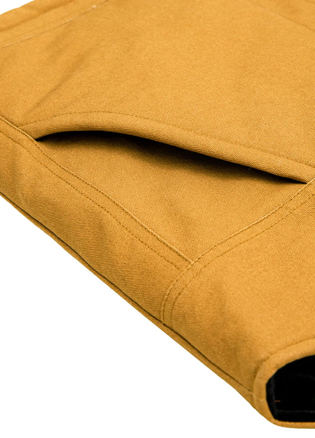 Close-up of the arctic-lined hand warmer pocket on men's yellow quilted canvas work vest