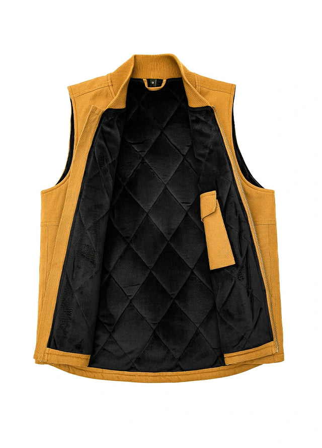 Detail of the interior lining on men's yellow arctic quilted lined canvas work vest