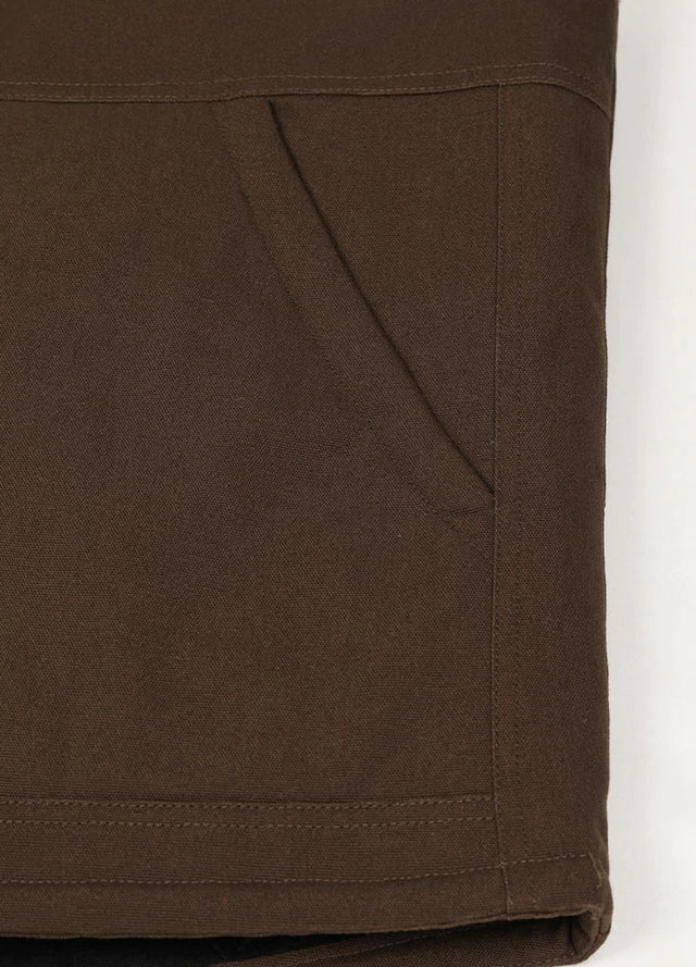 Close-up of the arctic-lined hand warmer pocket on men's Dark Brown quilted canvas work vest