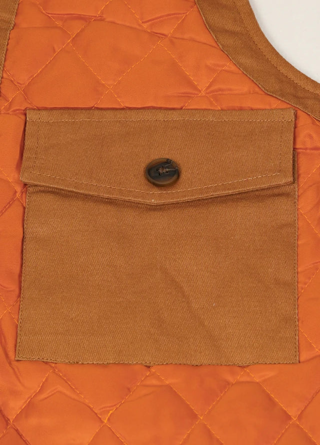 Detailed view of the yellow brown men's quilted lined adventure outdoor vest