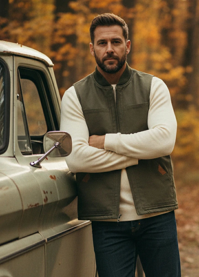 Lifestyle view of a man wearing army green men's work utility canvas vest sherpa lined-XR605AG0S,XR605AG0M,XR605AG0L,XR605AG0XL,XR605AG0XXL