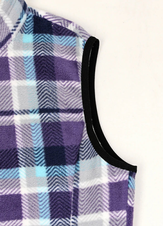 Close-up of women's warm sherpa-lined purple black fleece vest cuffs