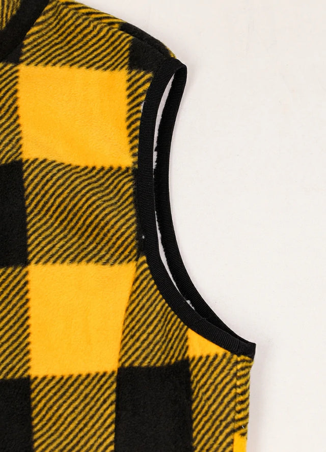 Close-up of women's warm sherpa-lined yellow black fleece vest cuffs