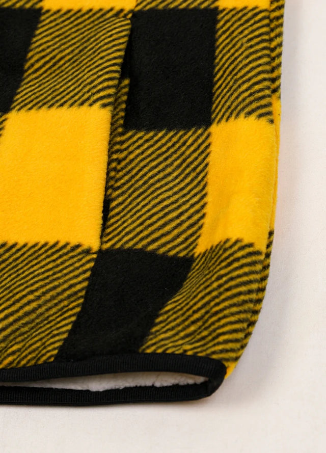 Detailed view of women's winter yellow black sweater fleece vest hand pocket