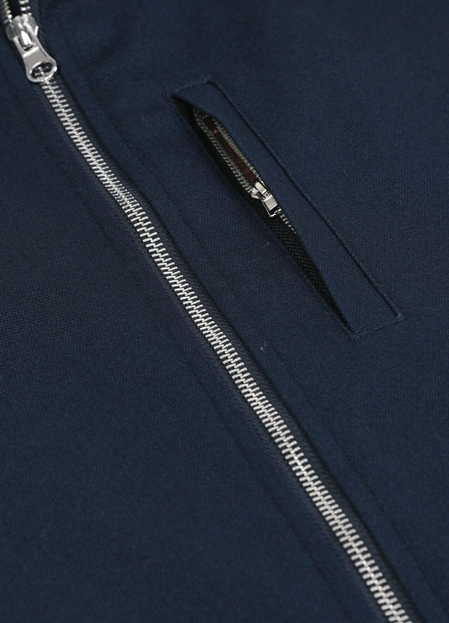 Detailed view of the pocket of the navy men's sherpa lined canvas work vest