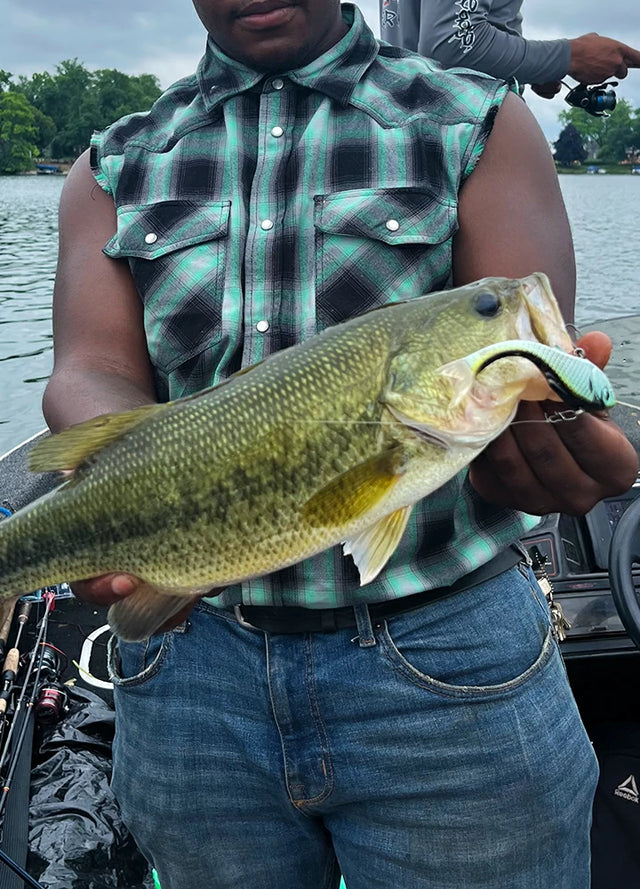 Front view of a man wearing a turquoise cool western plaid vest for men