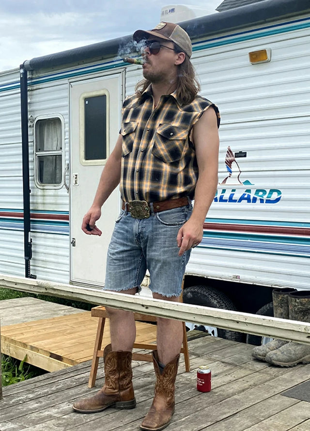 Front view of a man in an orange snap pearl western vest for men