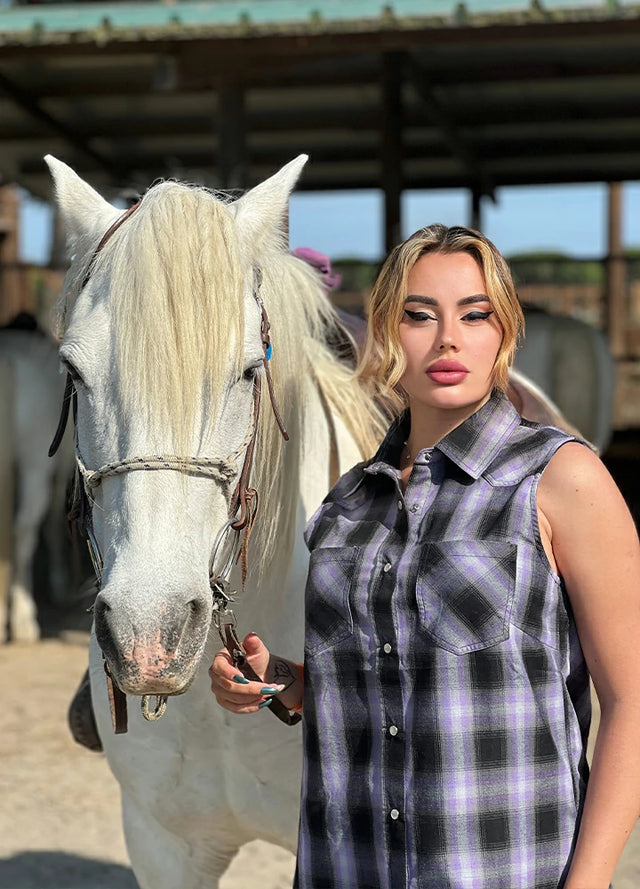 Women in a purple black summer western pearl snap plaid vest