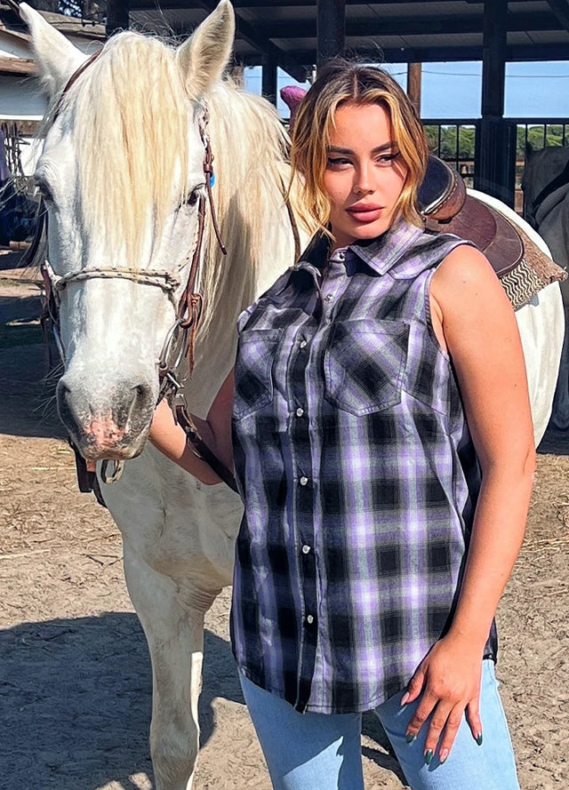 Side view of women in a cozy sleeveless purple black plaid vest