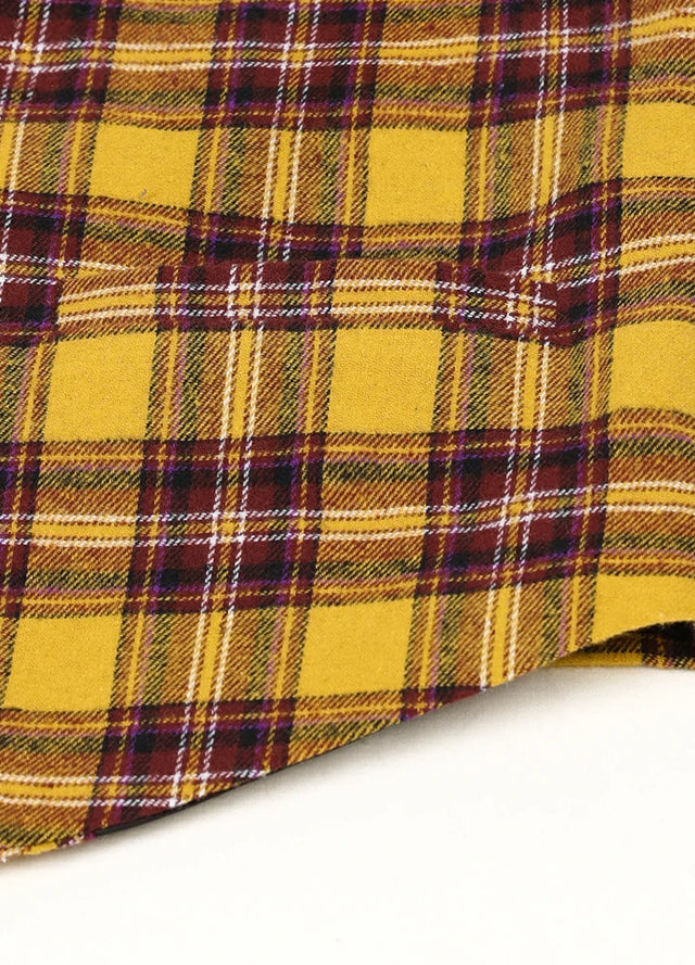 Detailed view of welt pocket on kids golden yellow dressy suit vest