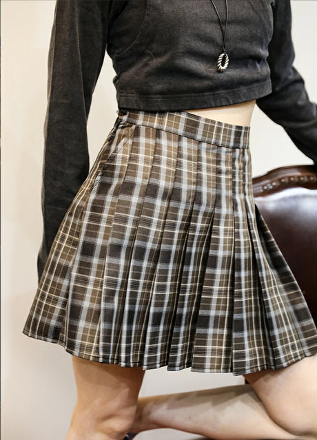 Side view of women in a elastic waist chocolate brown pleated skirt