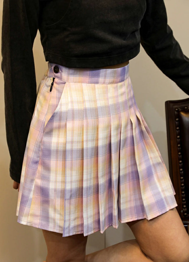 Side view of women in a elastic waist pink blue plaid pleated skirt
