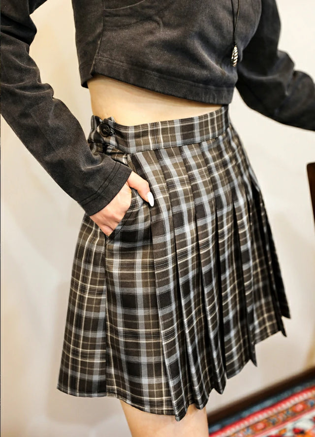 Side view of women in a side zipper chocolate brown skirt with side pocket