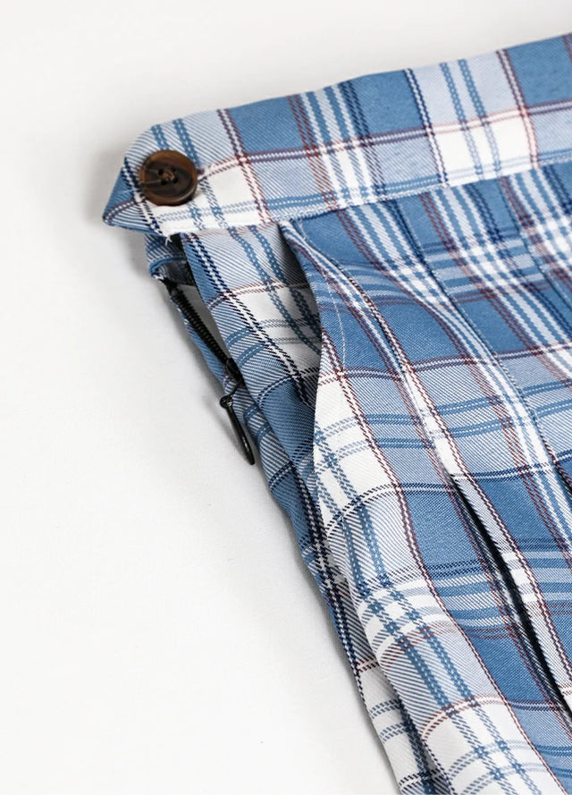 Close-up of women's white blue plaid high-waisted mini skirt side pocket