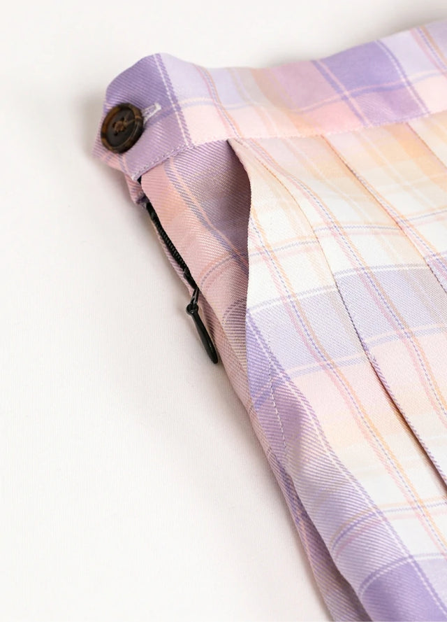 Close-up of women's pink blue plaid high-waisted mini skirt side pocket