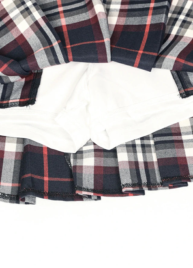Zoomed-in view of the built-in elastic shorts on a women's navy burgundy plaid mini skirt