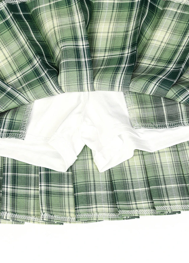 Zoomed-in view of the built-in elastic shorts on a women's green plaid mini skirt