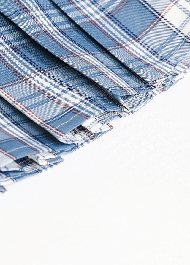 Detailed view of womens built-in elastic shorts blue white plaid mini pleated skirt hem