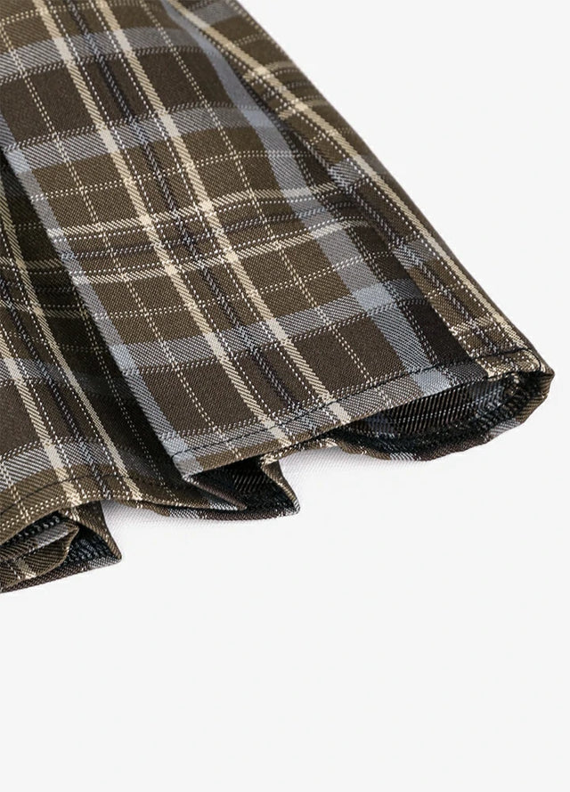 Detailed view of womens built-in elastic shorts brown plaid mini pleated skirt hem