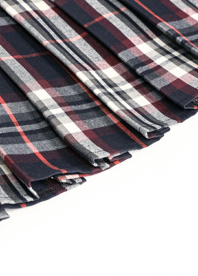 Detailed view of womens built-in elastic shorts navy burgundy plaid mini pleated skirt hem